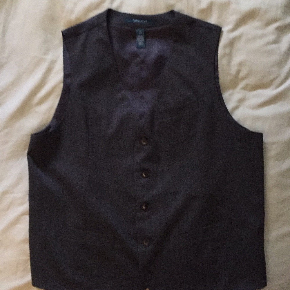 Grey vest with adjustable strap.  Size large